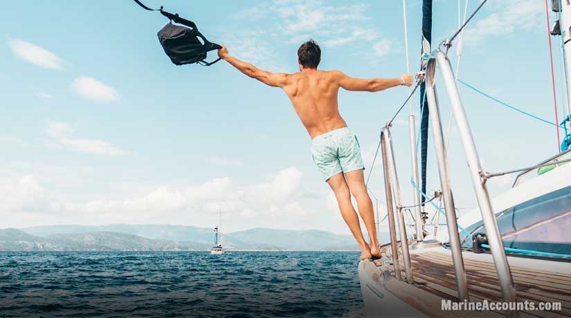 Man Leaning From Yacht Cables