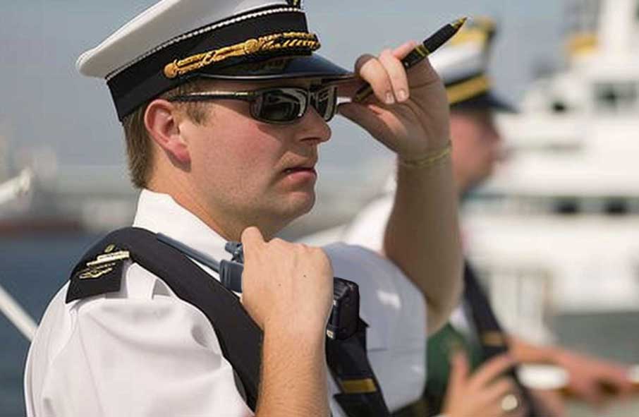 Yacht captain with handheld VHF radio