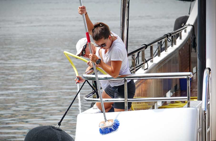 Crew Cleaning Yacht Exterior