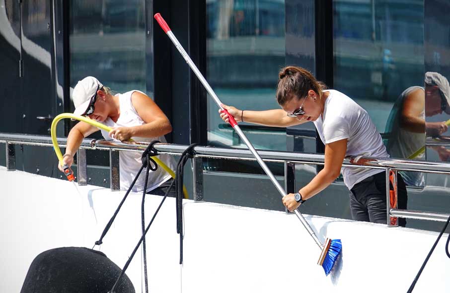 Yacht Crew Cleaning Ship's Exterior